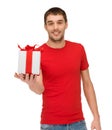 Smiling man in red shirt with gift box Royalty Free Stock Photo