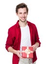 Smiling man in red shirt with gift box Royalty Free Stock Photo