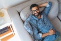 Smiling man relaxing at home Royalty Free Stock Photo