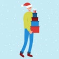 Smiling man in santa hat carrying tall stack of colored gift boxes. Preparing for Christmas and New Year celebration
