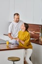 smiling man serving tasty breakfast near