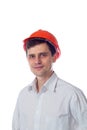 Smiling man in a shirt orange construction helmet Royalty Free Stock Photo