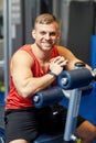 Smiling man sitting on exercise bench in gym Royalty Free Stock Photo