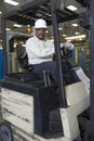 Smiling Man Sitting In Forklift Truck Royalty Free Stock Photo