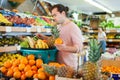 Smiling man standing with full shopping cart Royalty Free Stock Photo