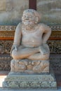 Smiling man statue at Batuan temple, Ubud, Bali Indonesia