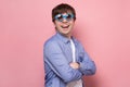 Smiling man in sunglasses posing in studio and looking at camera Royalty Free Stock Photo