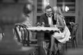 Smiling man talking to a woman in the cafe