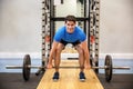 Smiling man about to lift a barbell Royalty Free Stock Photo