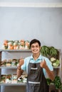 Smiling man with two thumbs up with vegetable products background Royalty Free Stock Photo
