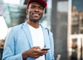 Smiling man typing in mobile