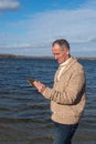 Smiling man uses digital tablet for working and communication Royalty Free Stock Photo