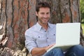 Smiling man using laptop Royalty Free Stock Photo