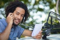 smiling man using smart phone while installing car-roof Royalty Free Stock Photo