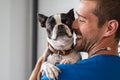 Vet cuddling pet dog Royalty Free Stock Photo