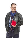 Smiling Man Wearing Black Leather Jacket Holding Christmas Gift on White Royalty Free Stock Photo