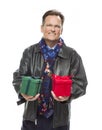 Smiling Man Wearing Black Leather Jacket Holding Christmas Gifts on Whit Royalty Free Stock Photo