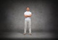 Smiling man in white t-shirt with crossed arms Royalty Free Stock Photo