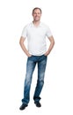 Smiling man in white t-shirt and jeanse isolated on white background Royalty Free Stock Photo