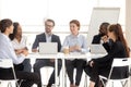 Smiling man and woman employee at meeting negotiation.