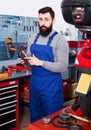 Smiling man worker counting sum for his service Royalty Free Stock Photo