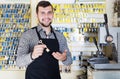 Smiling man worker showing key in workshop Royalty Free Stock Photo