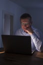 Smiling man working with laptop by night Royalty Free Stock Photo