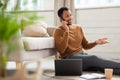 Smiling man working and talking on phone at home Royalty Free Stock Photo