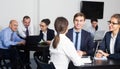 Smiling managers with laptops having a productive day Royalty Free Stock Photo