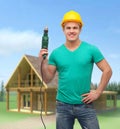 Smiling manual worker in helmet with drill machine Royalty Free Stock Photo