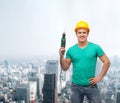 Smiling manual worker in helmet with drill machine Royalty Free Stock Photo