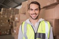 Smiling manual worker in warehouse Royalty Free Stock Photo