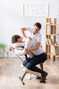 Masseuse doing arm massage for businessman Royalty Free Stock Photo