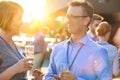 Smiling mature business colleagues talking at rooftop during success party Royalty Free Stock Photo