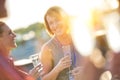 Smiling mature businesswoman talking with colleagues during success party on rooftop Royalty Free Stock Photo