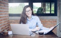 Portrait of young businesswoman working in modern office.