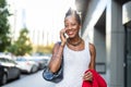 Smiling mature businesswoman using mobile phone in urban setting Royalty Free Stock Photo