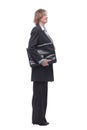 Smiling mature businesswoman walking to side with briefcase Royalty Free Stock Photo