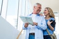 Smiling mature couple holding map Royalty Free Stock Photo