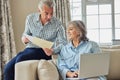 Smiling Mature Couple At Home Reviewing Domestic Finances On Laptop Royalty Free Stock Photo