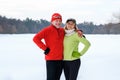 Smiling mature couple hugging in park in winter Royalty Free Stock Photo