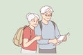 Smiling mature couple look at map traveling