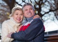 Smiling mature couple relaxing in park