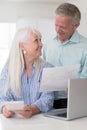 Smiling Mature Couple Reviewing Domestic Finances Royalty Free Stock Photo