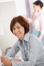 Smiling mature female office worker