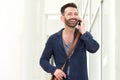 Smiling mature guy talking on mobile phone Royalty Free Stock Photo