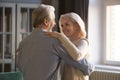 Loving mature couple dancing together celebrating at home Royalty Free Stock Photo