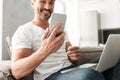 Smiling mature man using mobile phone Royalty Free Stock Photo