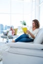 Smiling mature woman reading book with man Royalty Free Stock Photo