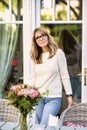 Smiling mature woman standing on the balcony at home Royalty Free Stock Photo